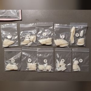 1100 fake nails with press-on glue and fake nail clippers